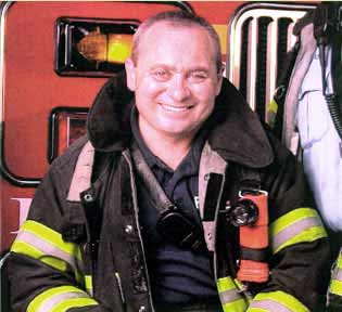 Eric Allen sitting on the front of the rig.