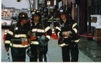 Thomas and two buddies in front of the firehouse 