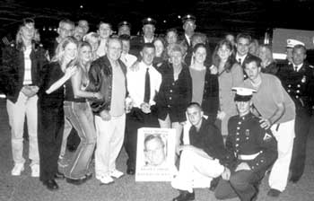 Family and friends of fallen Firefighter Kevin Smith (top photo) were among the more than 2,000 participants in Sunday night’s vigil in front of Squad 288–Hazardous Material Company One in Maspeth. The saddened but proud crowd held candles, offered prayers and sang patriotic songs. (photos: George Flo)